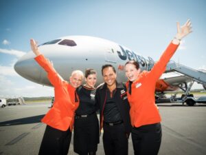 Jetstar cabin crew in front of a Dreamliner