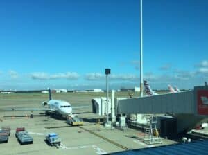 Alliance Airlines Fokker 70 with Virgin planes in background