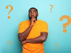 Confused man question marks
