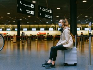 Woman at ZRH wearing mask Swiss checkin