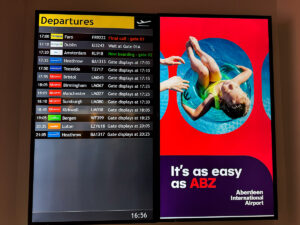 Aberdeen Airport departure board showing gate information