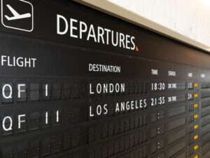 Qantas First Lounge flickerboard departures QF1 and QF11