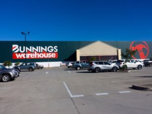 The Bunnings Warehouse hardware chain store in North Mackay, Queensland, Australia with a large carpark in front of it with customer cars.