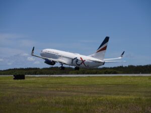 Rex Boeing 737-800 taking off from Brisbane on inaugural flight to Melbourne