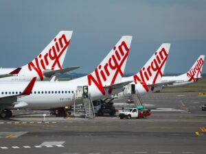 SYDNEY - APRIL 3: Aircrafts of the Virgin Australia fleet at Sydney Domestic Airport April 3th, 2014. Virgin Australia is Australia's second largest airline.