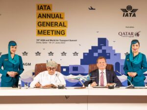 Oman Air CEO Eng Abdulaziz Al Raisi (seated, left) and oneworld CEO Rob Gurney (seated, right) sign the agreement for Oman Air to join oneworld in Doha at the IATA Annual General Meeting