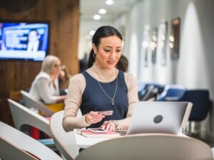 Woman paying online with Amex credit card