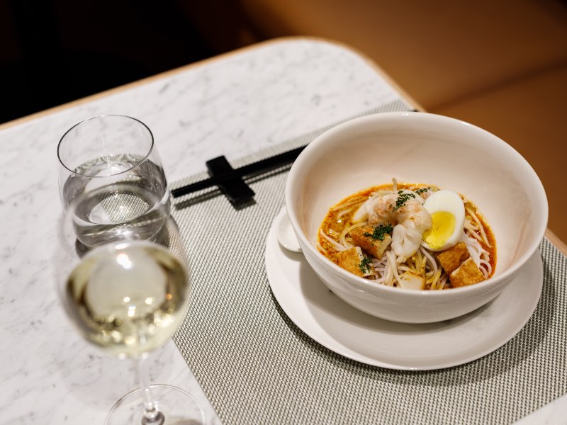 Laksa served in the Qantas Singapore First Lounge