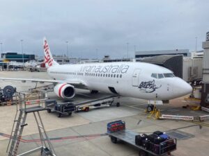 Virgin Australia Boeing 737-800 at Melbourne Airport, Qantas plane behind