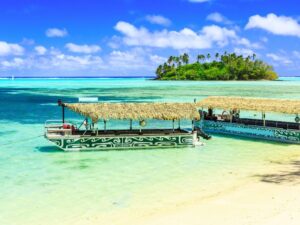 Rarotonga, Cook Islands. Motu Island and boats at the Muri Lagoon.