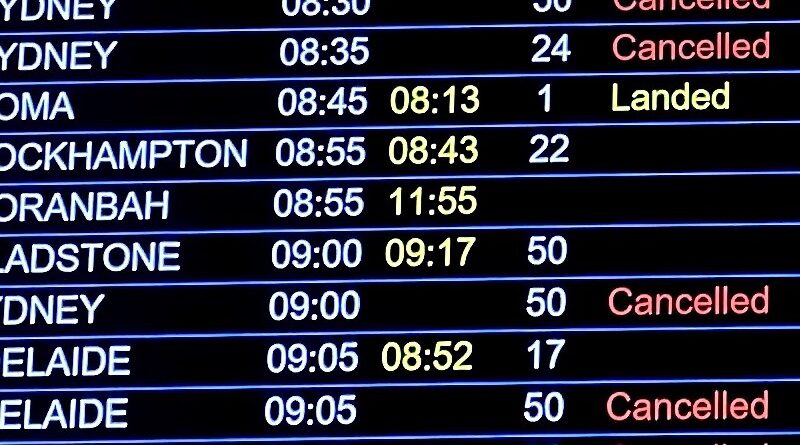 Brisbane airport departures board showing many cancelled flights