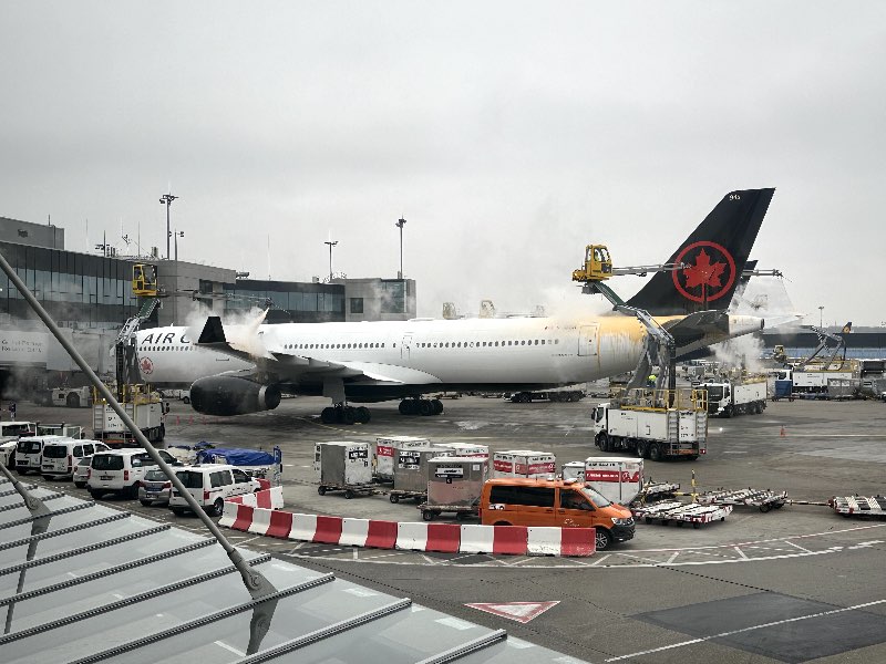 Air Canada Airbus A330 getting de-iced at Frankfurt Airport