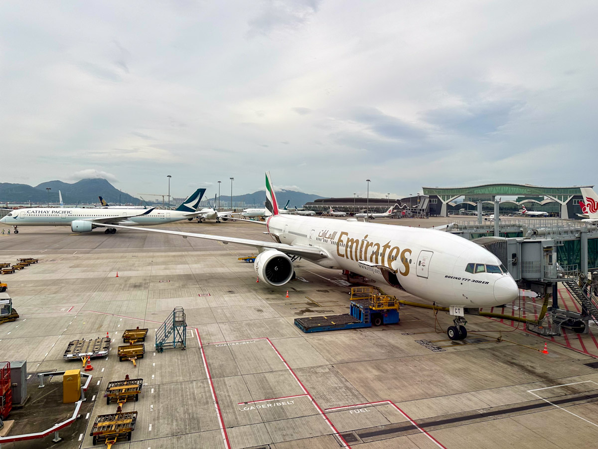 Emirates Boeing 777-300ER at Hong Kong Airport with a Cathay Pacific A350 in the background