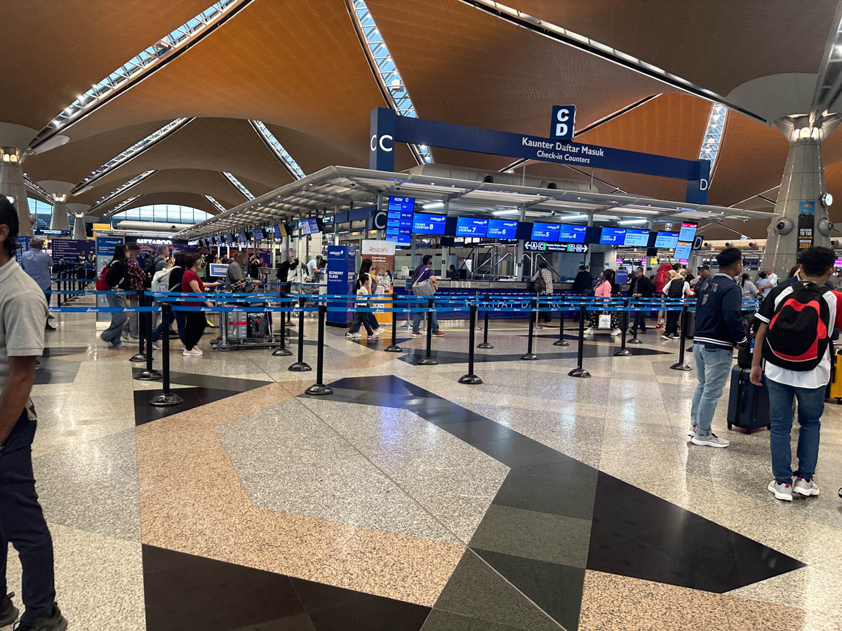 Malaysia Airlines economy class check-in counters at Kuala Lumpur International Airport