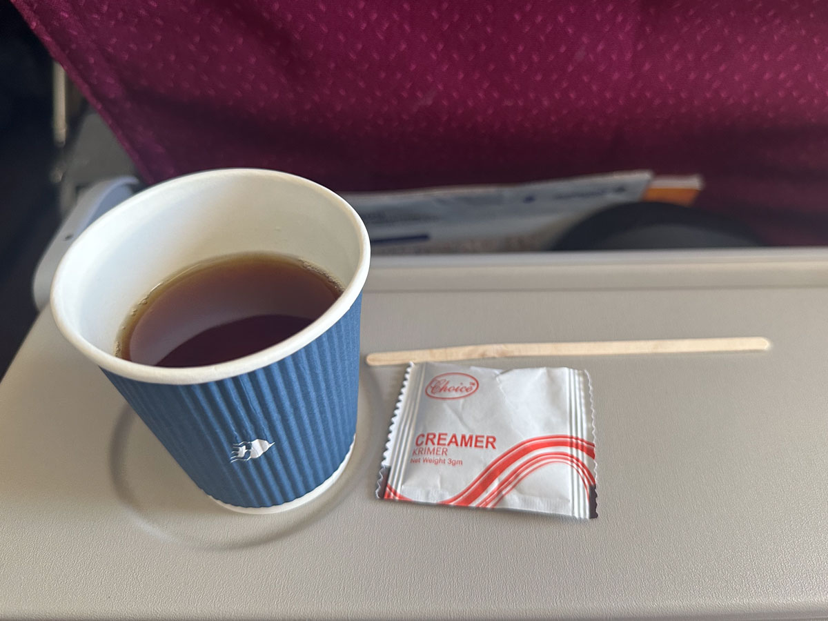 Tea with creamer in Malaysia Airlines Economy Class