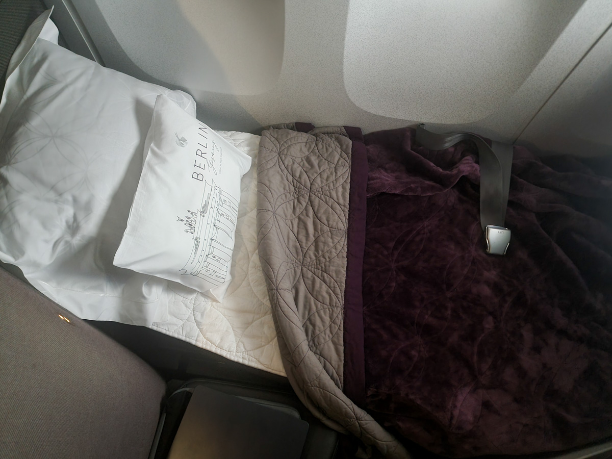 Qatar Airways Qsuite bed mode with mattress pad