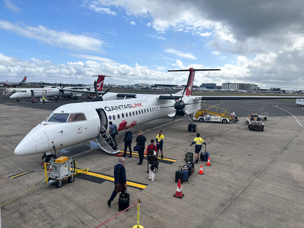 QantasLink Dash 8 Q400 in Christmas livery at Sydney Airport