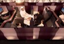 A family in Qatar Airways Qsuites