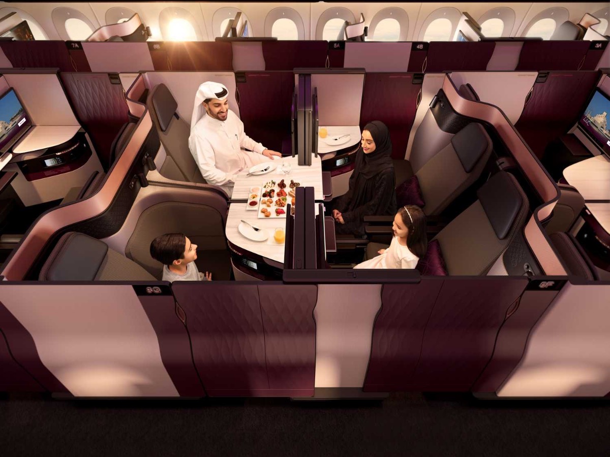 A family in Qatar Airways Qsuites