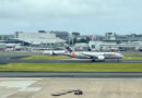 Jetstar Boeing 787-8 lands at Sydney Airport, with Virgin Australia plane in the background