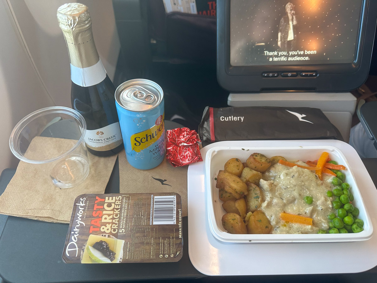 Chicken with mushroom sauce and vegetables served in Qantas international Economy Class