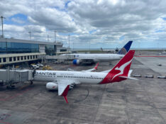 A Qantas Boeing 737-800 and a United Boeing 777 at Auckland Airport