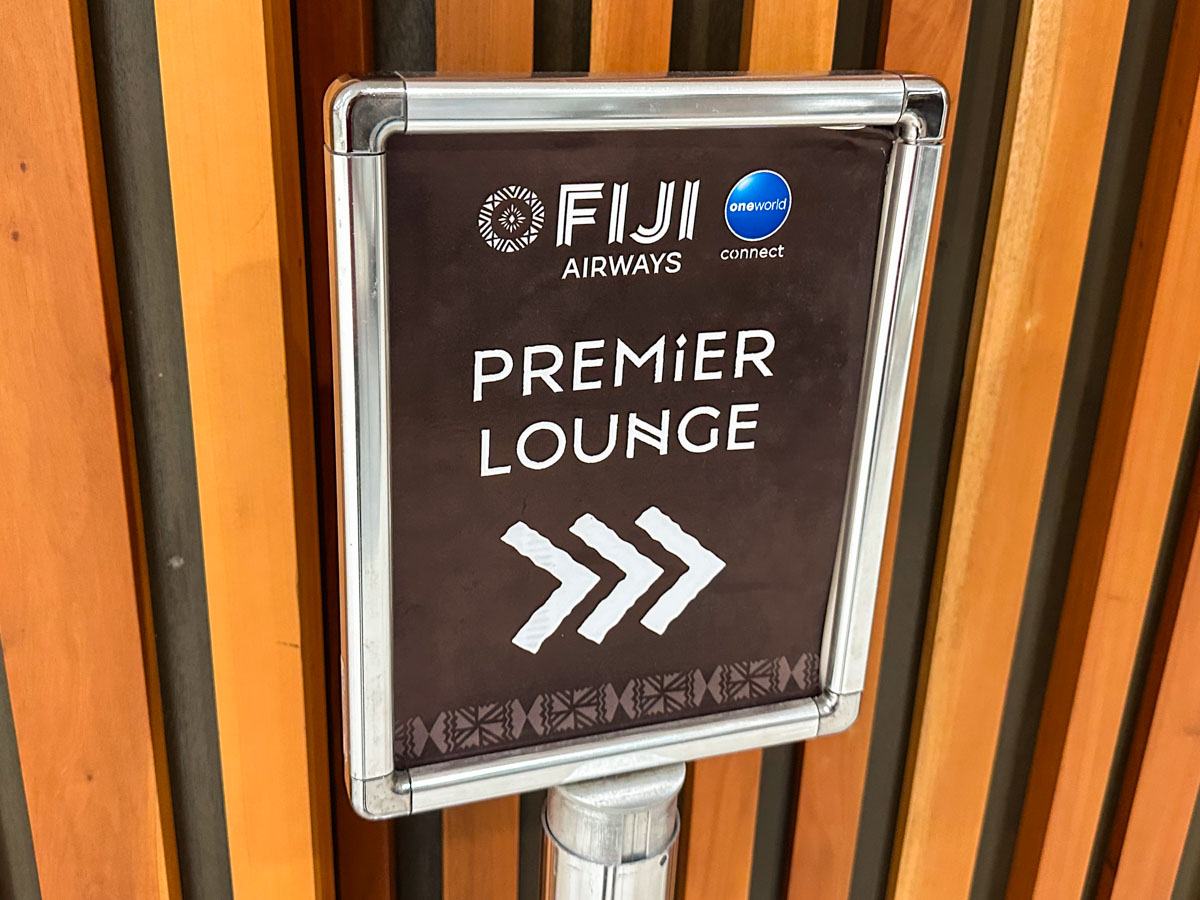 Fiji Airways Premier Lounge sign at NAN with oneworld connect branding