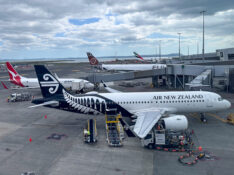 Air New Zealand Airbus A320neo at Auckland with a Qantas 737, Fiji Airways 330 and Emirates A380 in background