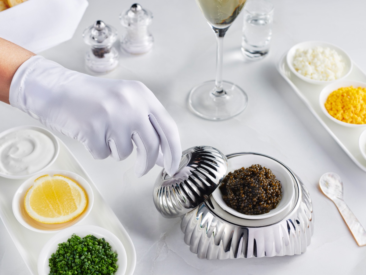 Emirates has introduced "gloved service" in First Class along with its unlimited caviar and premium champagne
