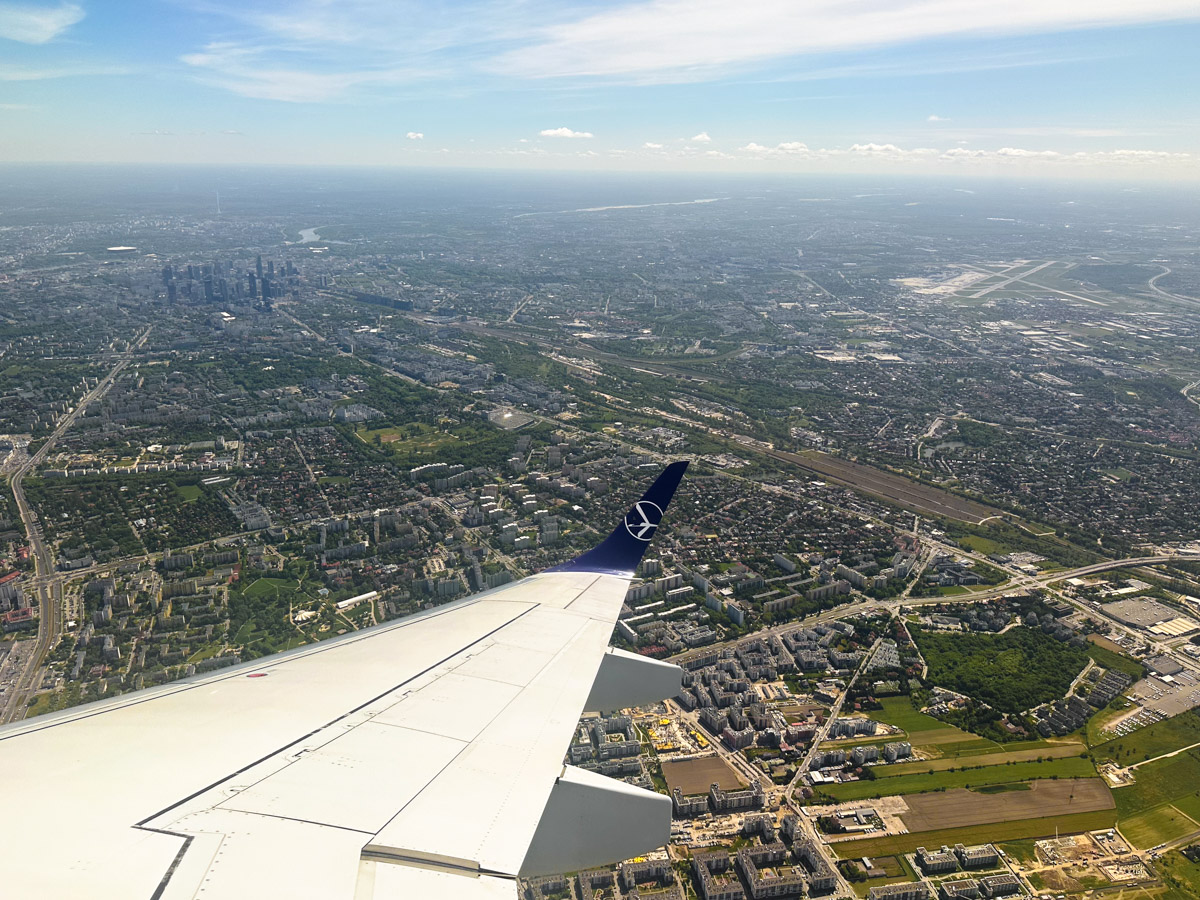 View of Warsaw city and Chopin Airport (WAW) after taking off an a LOT E195
