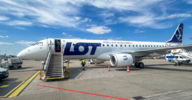LOT Polish Airlines E195 at Warsaw Chopin Airport at a standoff bay
