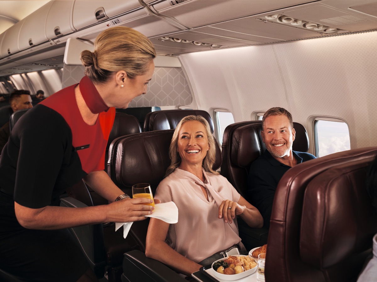 Couple being served in Qantas Boeing 737-800 Business Class