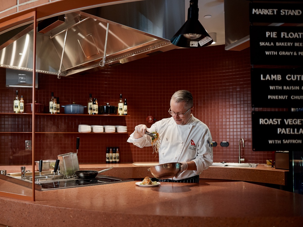 Market Stand with dishes such as pie floaters in the Qantas ADL Business Lounge