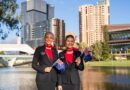 Qantas cabin crew with New Zealand flags in Adelaide