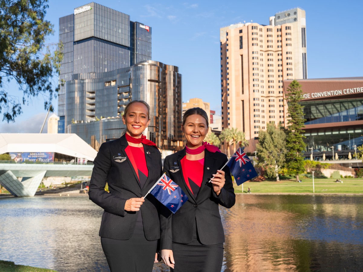 Qantas cabin crew with New Zealand flags in Adelaide
