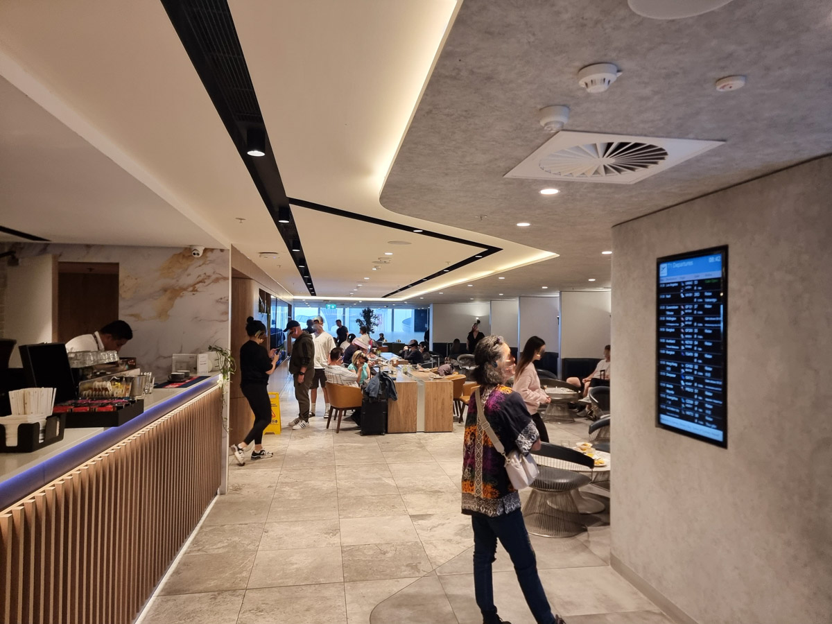 Crowd and sitting area in the AMEX Centurion Lounge Sydney