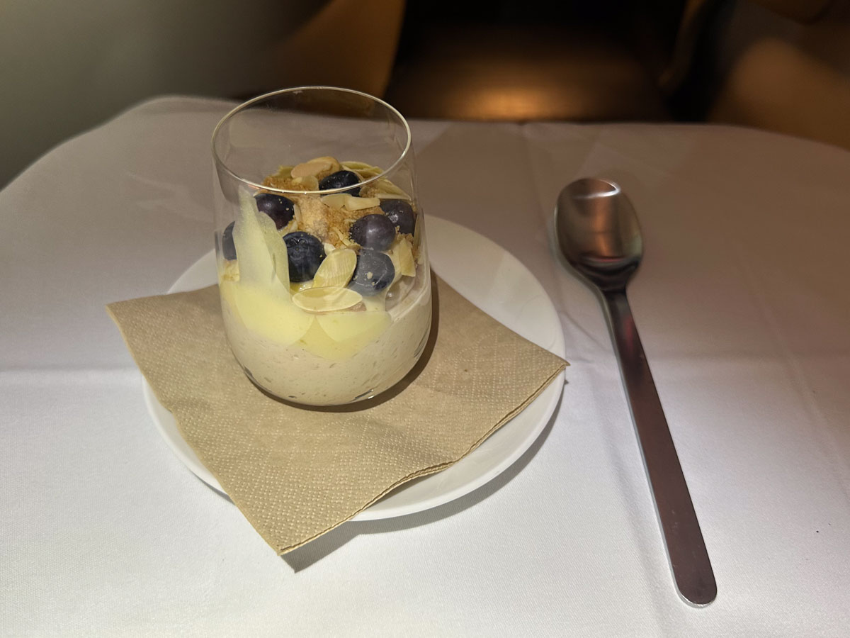 Almond and cinnamon panna cotta trifle with coconut and lime crumble for dessert in Qantas business class