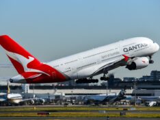 Qantas A380 takes off at Sydney Airport, Air New Zealand and Singapore Airlines in background
