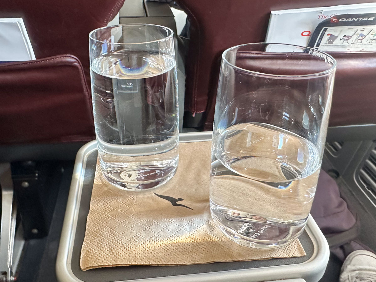 Pre-departure still and sparkling water in Qantas business class