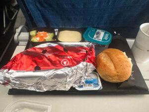 Turkish Airlines hot meal with butter and a bread roll