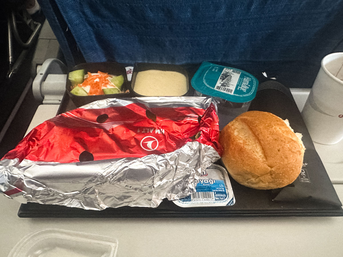 Turkish Airlines hot meal with butter and a bread roll