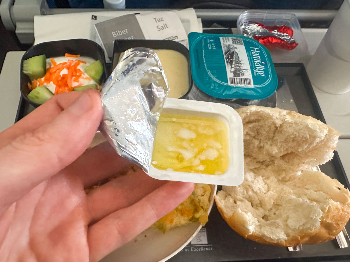 Melted butter over a Turkish Airlines economy class meal