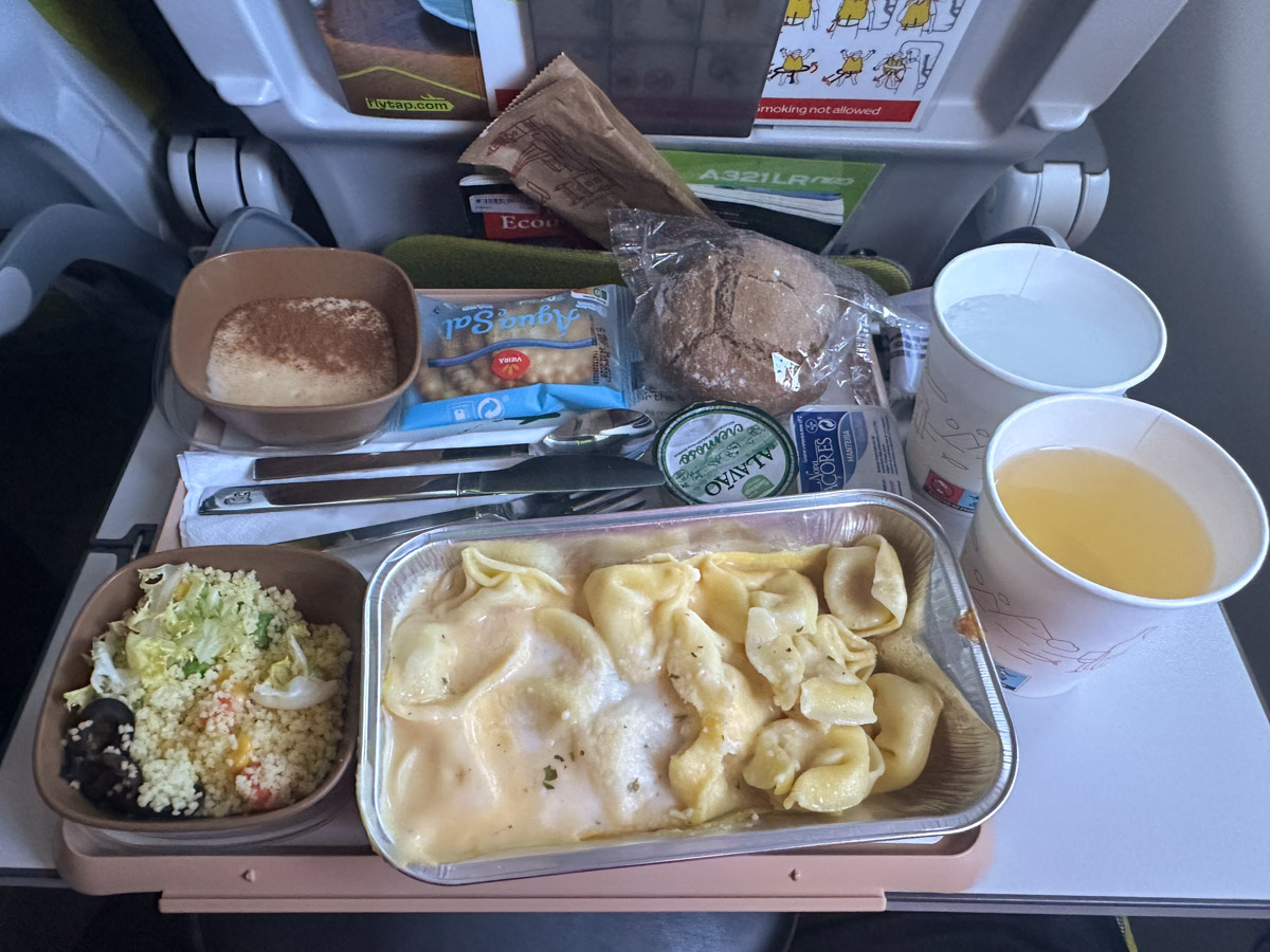 Cheese tortellini with pumpkin sauce for dinner in TAP Air Portugal economy class