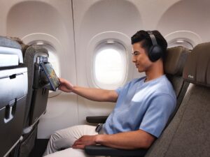 Qantas passenger watching a movie in Economy Plus