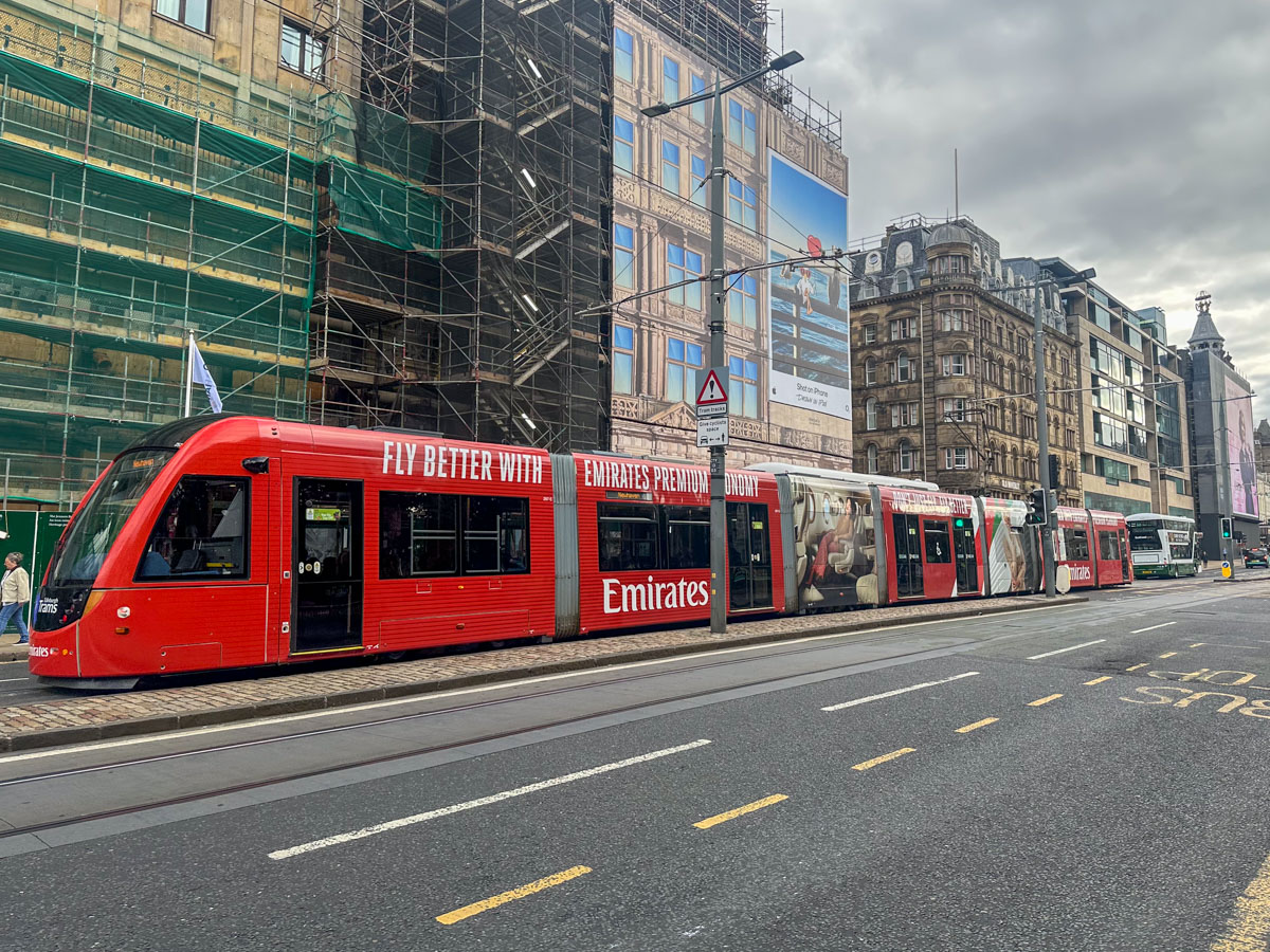 Emirates premium economy advertisement on a tram in Edinburgh