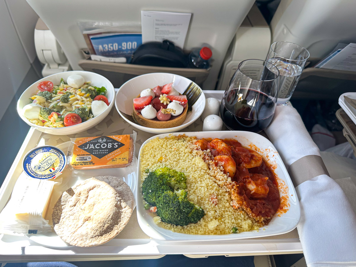 Blanched prawns in tomato concassé, served with vegetable couscous and broccoli in Emirates premium economy