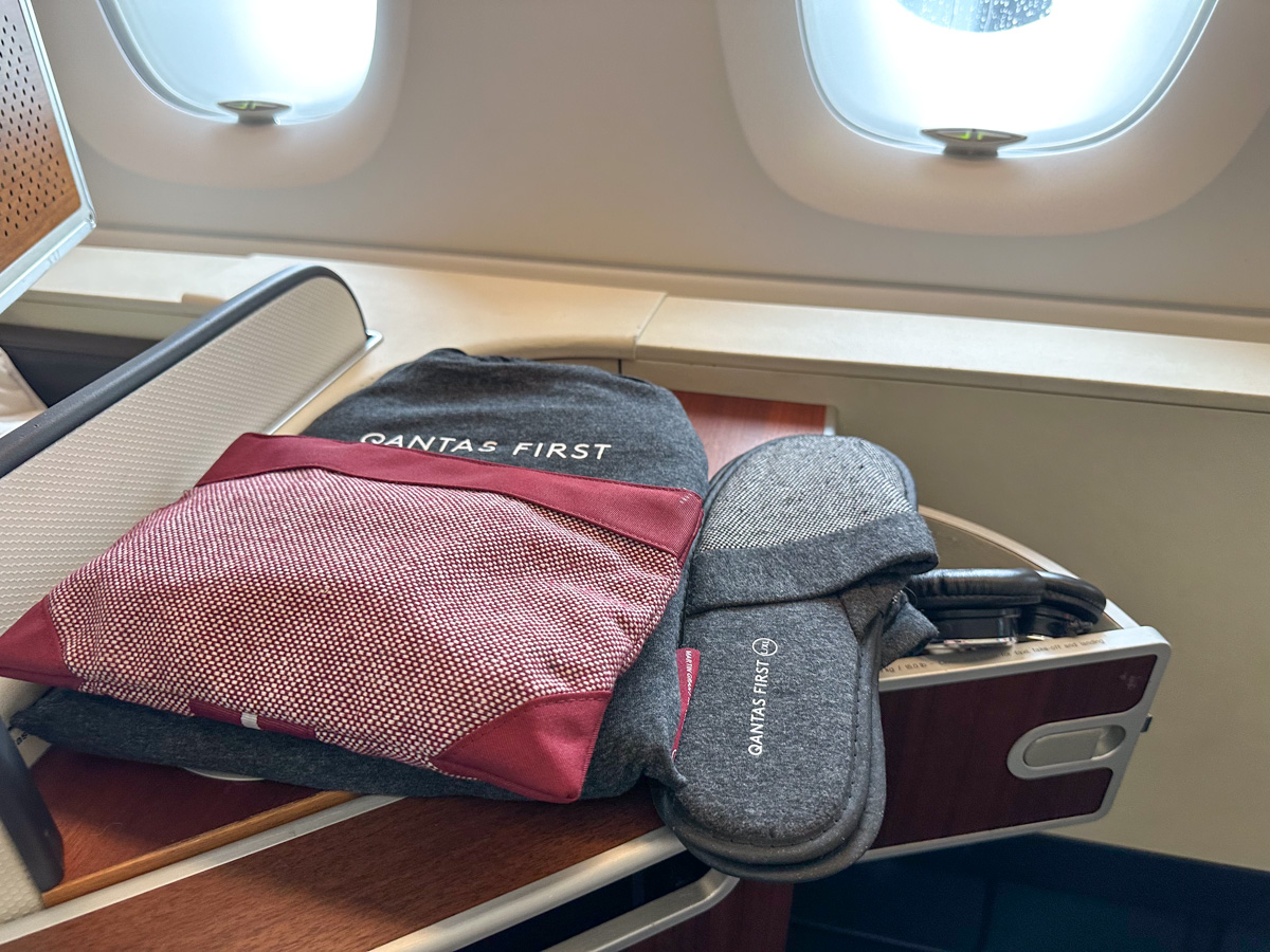 Qantas First Class pyjamas, slippers and amenity kit