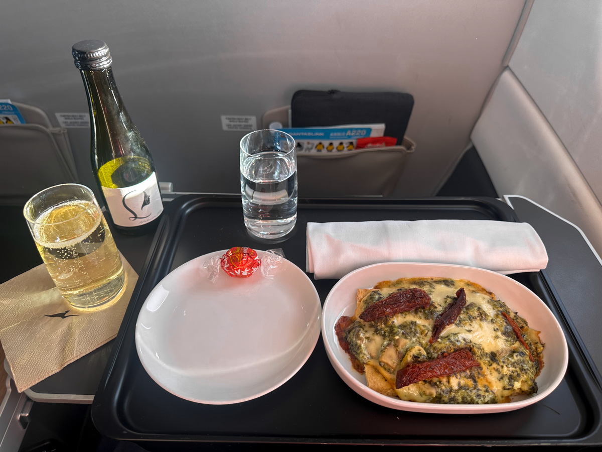 Qantas Business Class meal on QF1281 - a pizza with sparkling wine