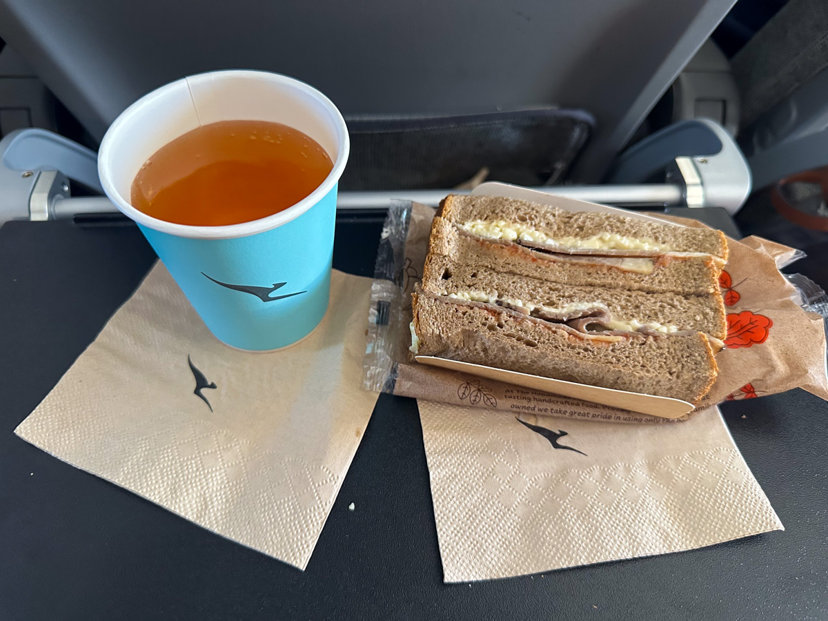 Sandwich and apple juice in Qantas Economy Class