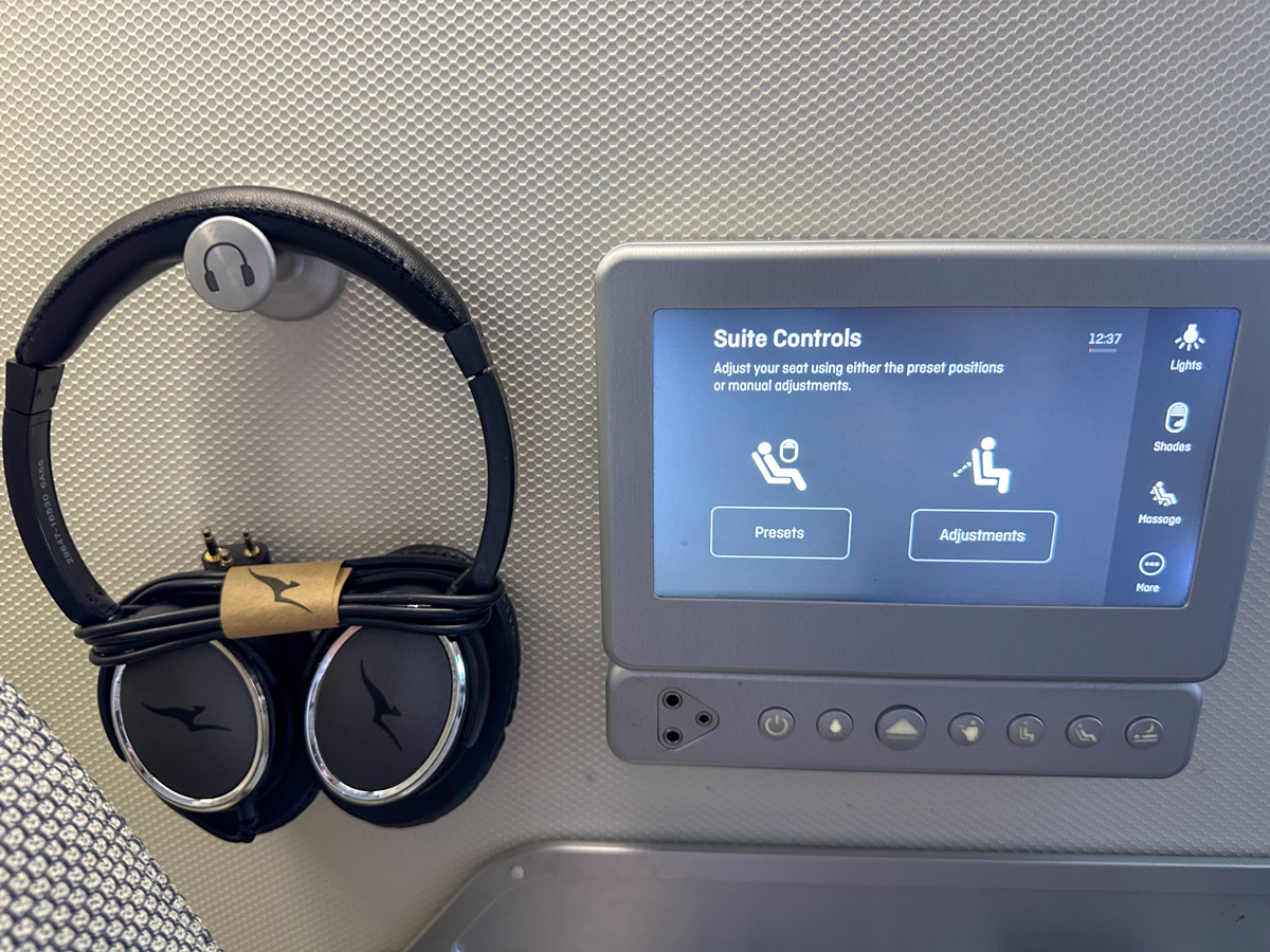 Qantas A380 First Class suite control panel with headphones